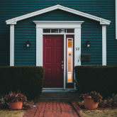 Front door of a blue house.