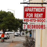 Apartment for rent sign on a building