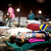 View of beds at a group shelter.