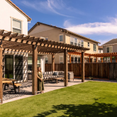 Woman in newly renovated backyard