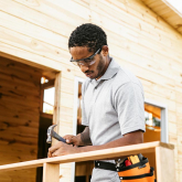 Man using a hammer outdoors
