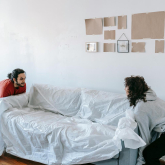 Couple moving a couch