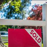 Sold sign in front of a home.