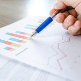 Person examining charts