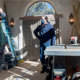 Workers inside a home being remodeled.