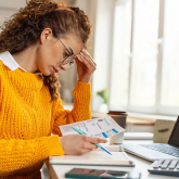 Woman paying bills.