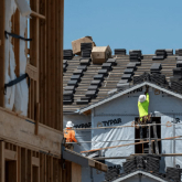 Workers building a house.
