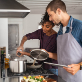 Roommates cooking together.