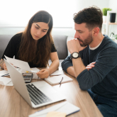 Couple looking at bills.