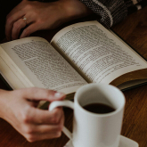 Person reading a book.