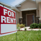 For Rent sign in front of a house.