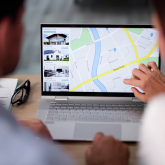 Couple looking at real estate listings online.