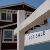 House with a for sale sign