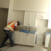 Worker renovating a kitchen.