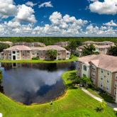 Apartment buildings next to a body of water.