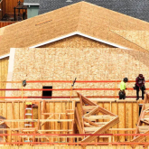 Construction workers building a home.