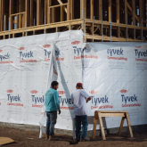 Workers on a new home construction site.