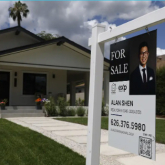For sale sign in front of a home.