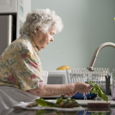 17511-an-elderly-woman-washing-produce-pv.jpg