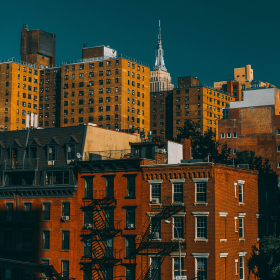 View of urban housing with high rises and townhouses.
