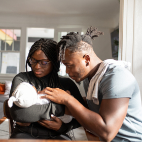 Black couple with newborn baby