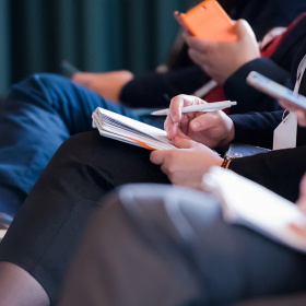 People taking notes.