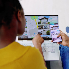 Couple looking at real estate listings online.