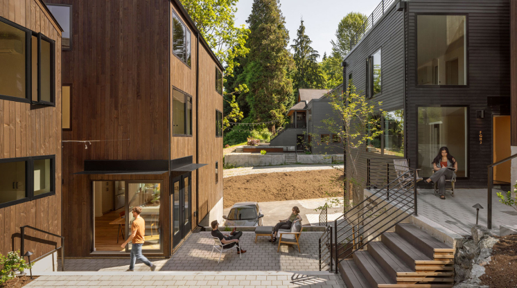 Attached modern homes surround a shared courtyard.