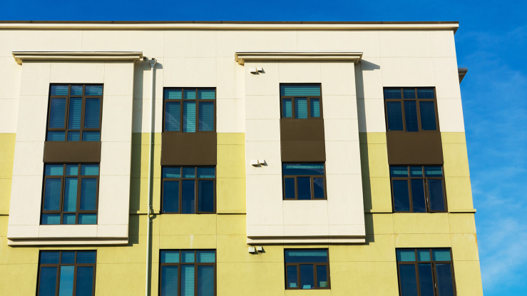 Facade of modern multifamily housing.