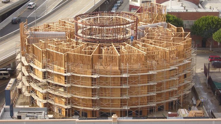 The New Carver Apartments housing under construction, showing wooden structure