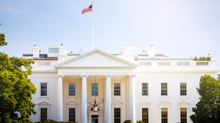 Front of the US White House on a sunny day.