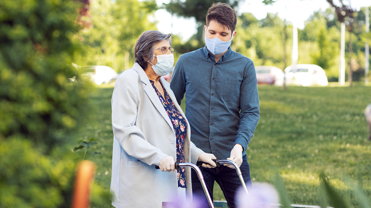 Older woman walking with young man.