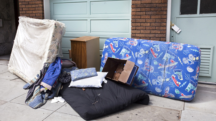 Family's belongings outside house after eviction.
