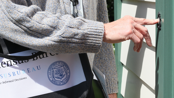 Census worker ringing doorbell.