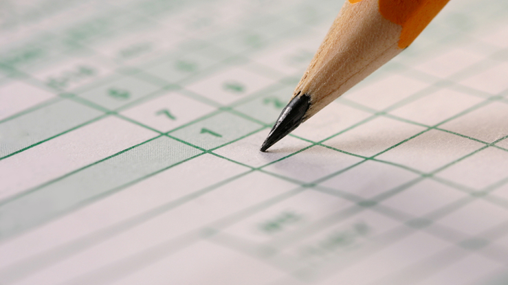 Pencil marking a scorecard.