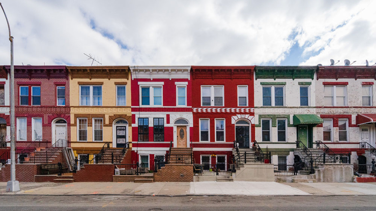 View of colorful townhouses in Brooklyn, NY.