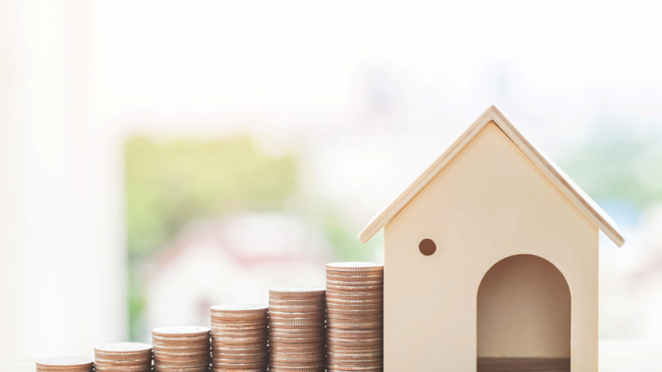 House with increasing piles of coins