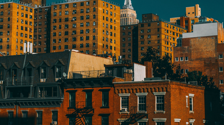 View of urban housing with high rises and townhouses.