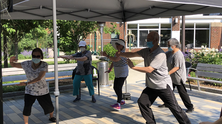 Residents at 2Life Communities performing Tai Chi.