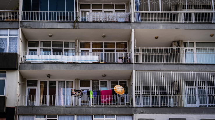 Multifamily apartment building with balconies.