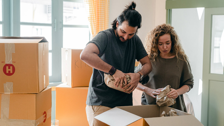 Couple unpacking their boxes after moving.