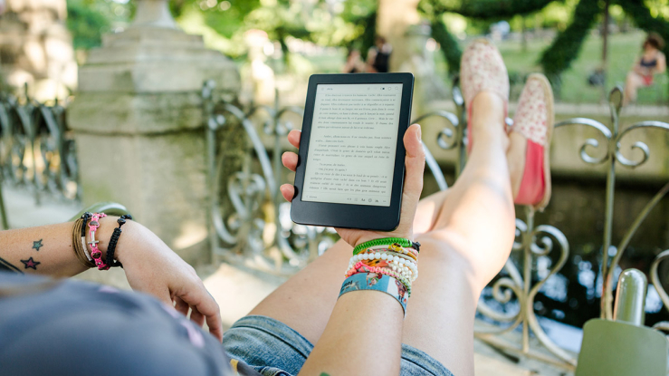 Person reading text on ereader.