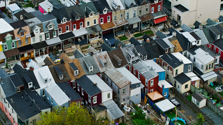 Street with colorful rowhouses.