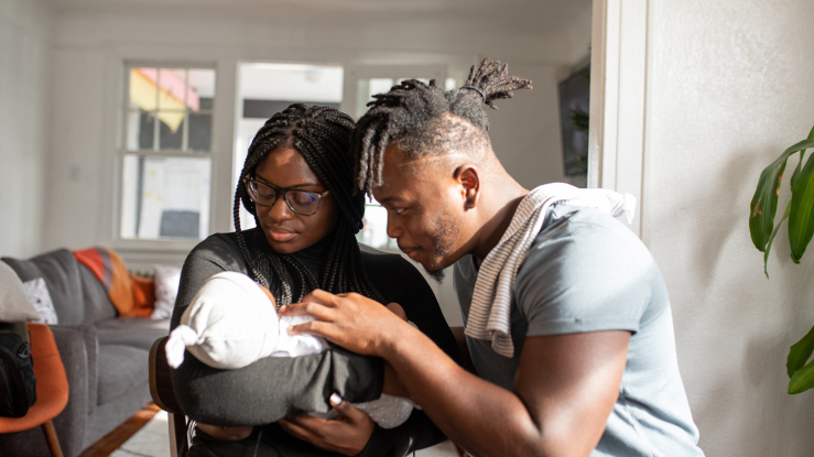 Black couple with newborn baby