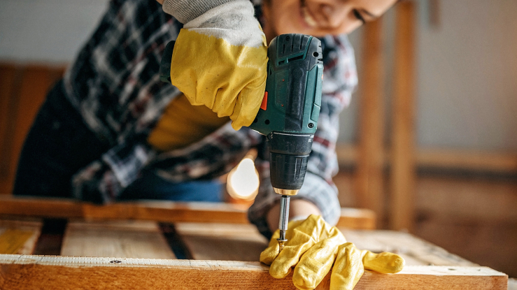 Woman using a drill