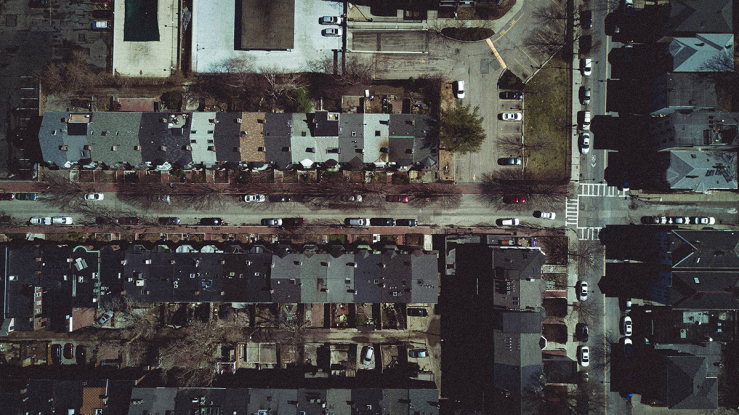 Aerial view of small apartment buildings.