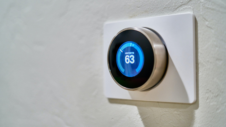 Smart thermostat on wall.