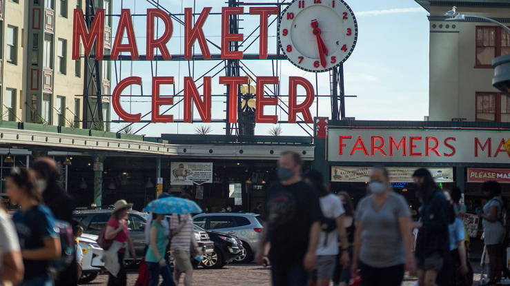 Crowd walking in public market in Seattle.