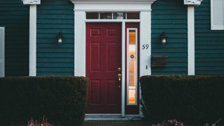 Front door of a blue house.