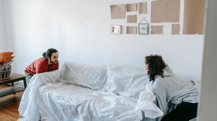 Couple moving a couch